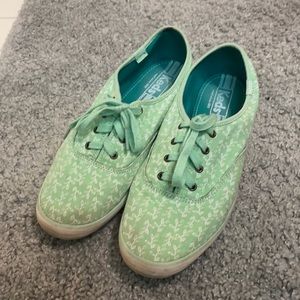 Mint green printed Keds with two pairs of laces.